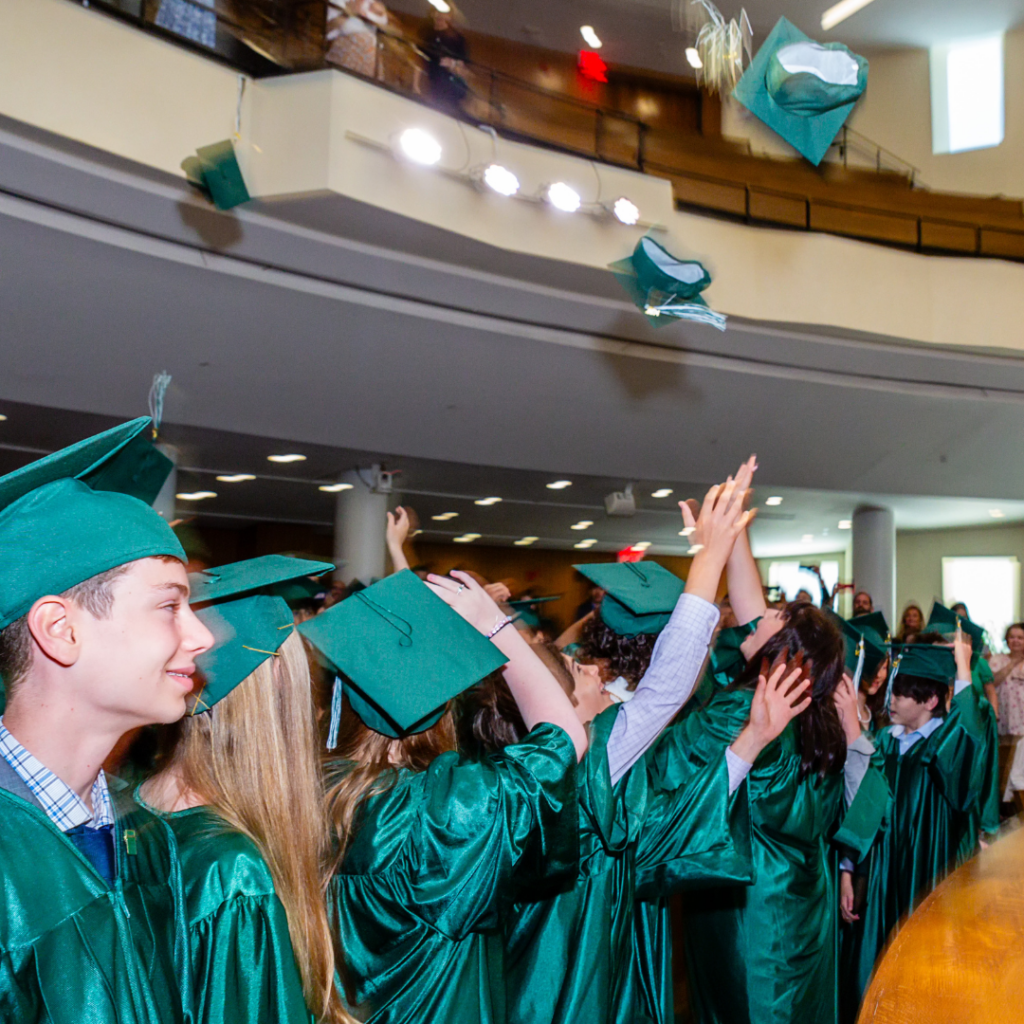 Graduation caps tossed in the air